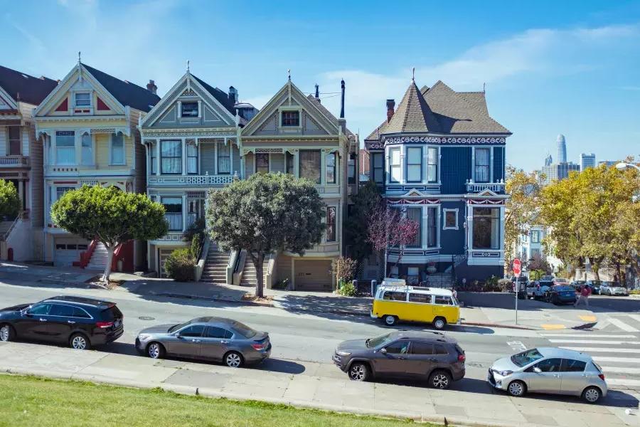 Cars parked in front of the Painted Ladies